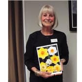 Outgoing president of the Kenilworth Soroptimists, Julie Pemberton was presented a card and photos from her year in the role. Photo supplied