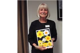 Outgoing president of the Kenilworth Soroptimists, Julie Pemberton was presented a card and photos from her year in the role. Photo supplied