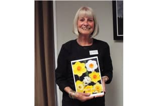 Outgoing president of the Kenilworth Soroptimists, Julie Pemberton was presented a card and photos from her year in the role. Photo supplied