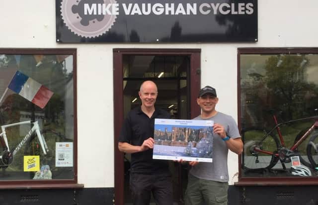 Mike Vaughan with his colleague Dan. Mike Vaughan Cycles have donated a specialised front and rear cycle light set as a prize for the calendar.