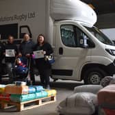 Organisers at the warehouse as they gather and sort donations for the third delivery.