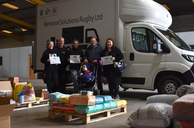 Organisers at the warehouse as they gather and sort donations for the third delivery.