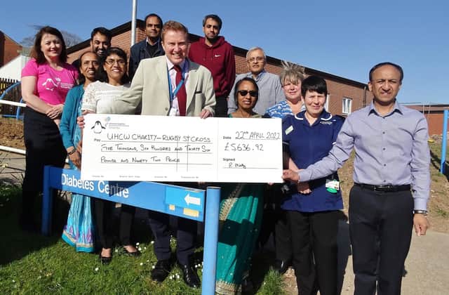 Chhaganbhai Mistry's family hand over a cheque for £5,636.92 to staff at St Cross. Pictured with them are Janine Beddow (Hospital of St Cross site manager), Simon Fletcher (consultant nephrologist), Sara Mellett (palliative care clinical nurse specialist) and Jo O’Sullivan, (UHCW Charity director).