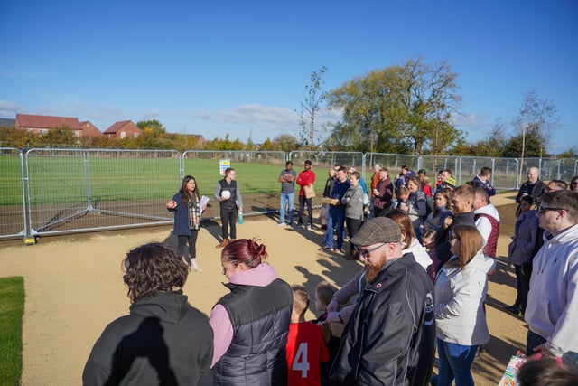 Residents gather for the opening of the allotment.