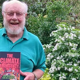 Chris Philpott and his new book The Climate Emergency And What Can Do About It. Picture supplied.