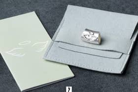 One of the sterling silver Angel Baby charms designed by Pooja Sahny which are being sold to raise money for the Lily Mae Foundation in memory of Pooja's son Avi. Credit: John Owen Photography.