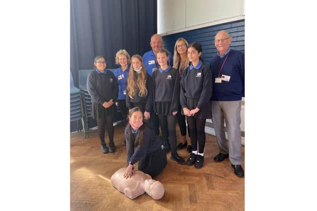 Four of the Kenilworth Heartsafe volunteer training team with some of the Year 8 pupils. Photo supplied