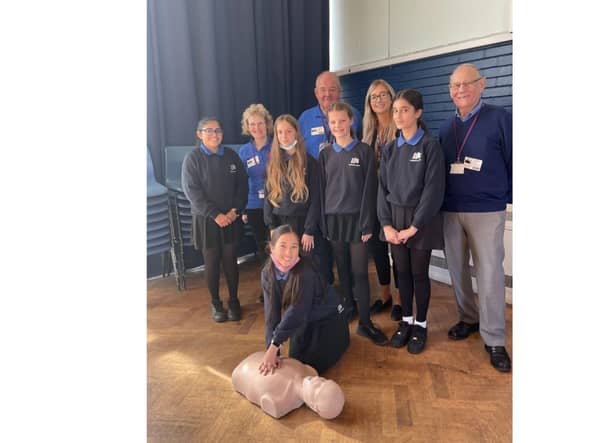 Four of the Kenilworth Heartsafe volunteer training team with some of the Year 8 pupils. Photo supplied