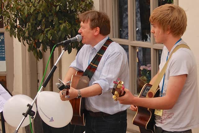 Bill and Matthew Bates performing together.