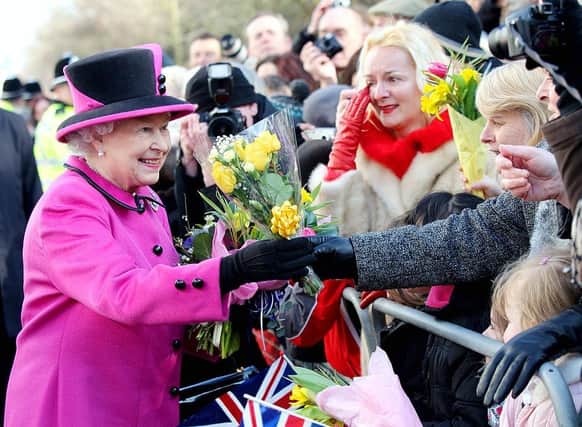 Queen Elizabeth II greets the crowds after visiting the Warwickshire Justice Centre on March 4, 2011 in Leamington Spa.