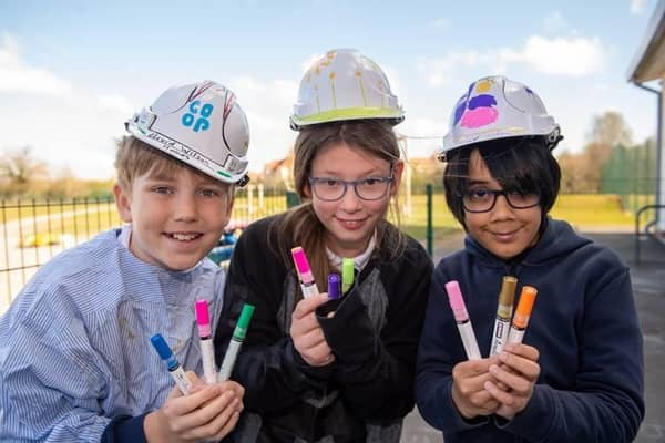 Heathcote Primary students wearing decorated hard hats and donated pens from David Wilson Homes. Photo supplied