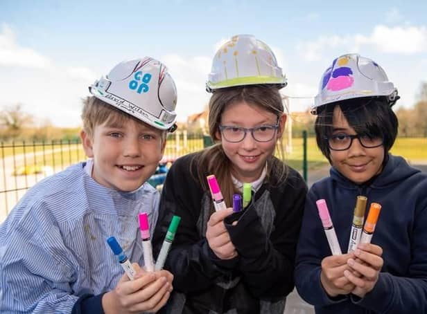 Heathcote Primary students wearing decorated hard hats and donated pens from David Wilson Homes. Photo supplied