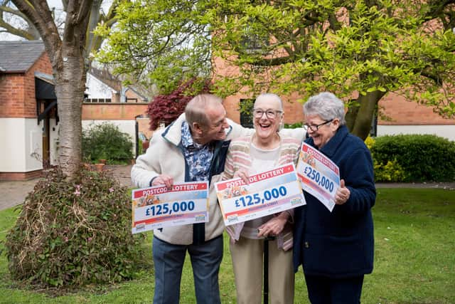 WIN IT TOGETHER: Graham, Victoria and Evelyn celebrate