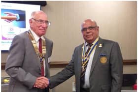 Warwick Rotary President Keith Talbot receives good wishes of Paul Jaspal, outgoing President. Photo by Warwick Rotary Club