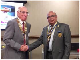 Warwick Rotary President Keith Talbot receives good wishes of Paul Jaspal, outgoing President. Photo by Warwick Rotary Club