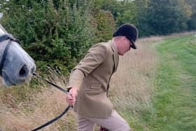 A Warwickshire Hunt servant removes the dead body of the fox at Monday's hunt at Idlicote