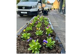 Warwick Town Council has emptied and replanted planters in the St Johns area after being let down by Warwickshire County Council.