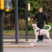 A guide dog trainer and guide dog in Leamington. Photo by Eleanor Stephens.