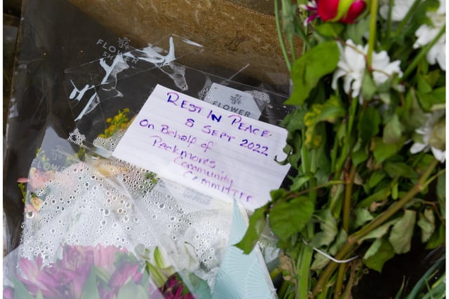 Floral tributes have been laid outside Shire Hall in Warwick. Photo by Mike Baker