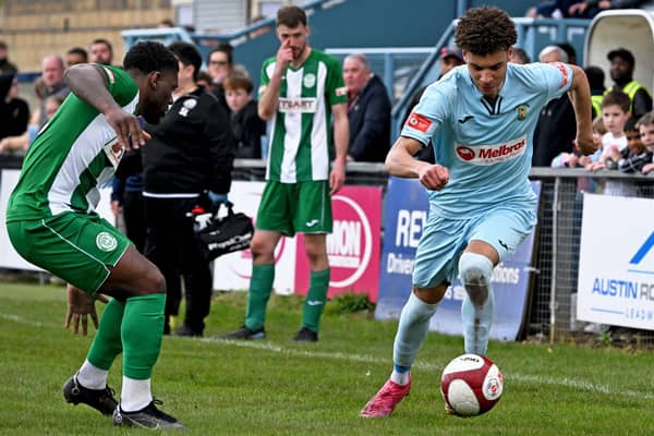 Theo Rowe takes on his man during Rugby's 1-1 draw with Bedworth on Saturday (Picture: Martin Pulley)