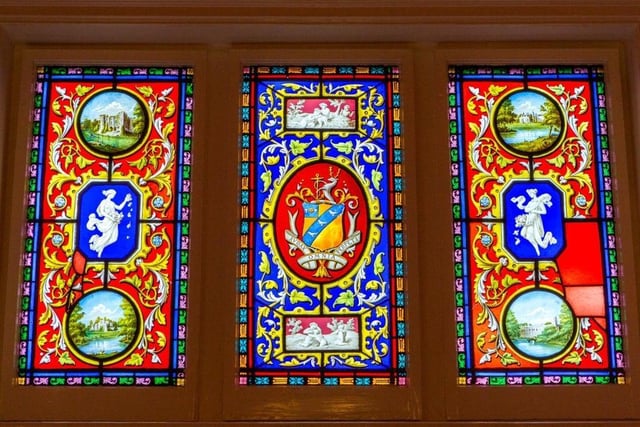 A close-up look at the stained glass window at the half landing. Photo by Hamptons