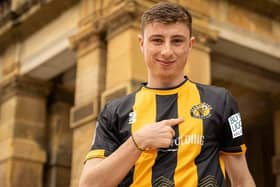 Leamington FC's new home shirt for the 2023/24 season modelled by striker Cally Stewart. Photo by Cameron Murray.