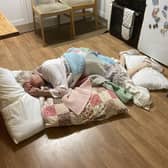 Lilian Delday lies on her kitchen floor during her wait of more than ten hours for an ambulance to arrive after she suffered a broken hip in a fall at her home in Warwick.
