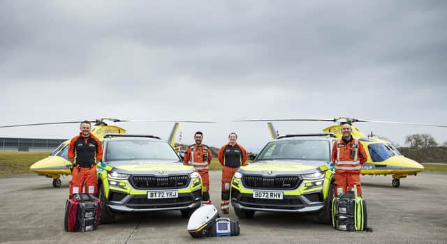 Some of the team with the critical care cars.