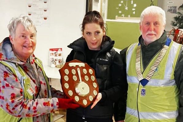 Petra, winner of the Rugby Rokeby Lions Dash, being presented with the winners shield by Ralph Watson, President of Rugby Rokeby Lions.