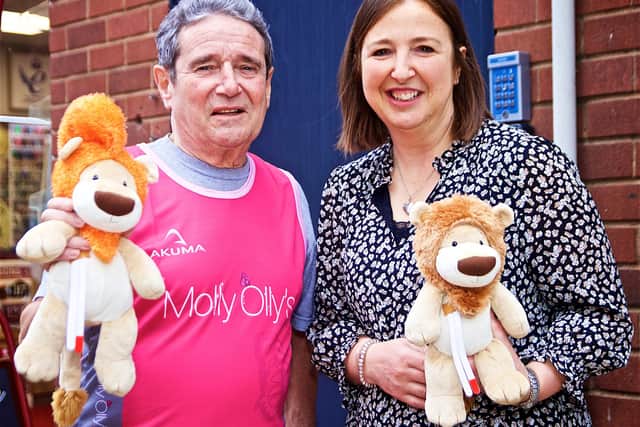 Tony Cunningham with Rachel Ollerenshaw with a small Olly The Brave toy. Photo by David Fawbert