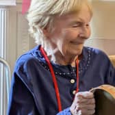 Resident at HC-One’s Victoria Park Care Home joining in the fun with tambourine