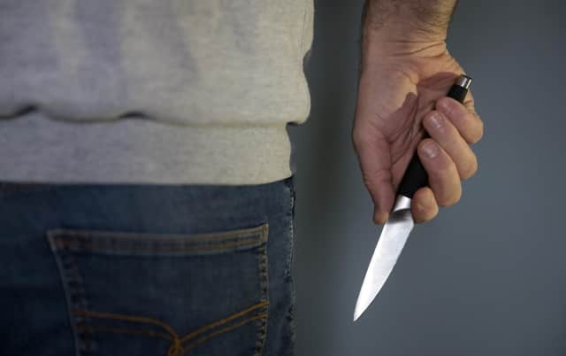 A model poses holding a knife. PA Photo. Picture date: Thursday January 16, 2020. Photo credit should read: Andrew Matthews/PA Wire