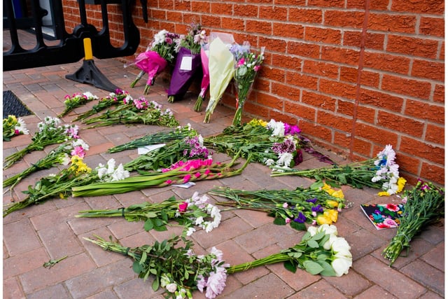 Floral tributes left near the civic centre in Whitnash. Photo by Mike Baker