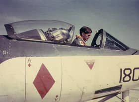 Lieutenant David Gunn RN carrying out preflight checks in a Seahawk fighter ground attack aircraft in the Mediterranean in 1958.
