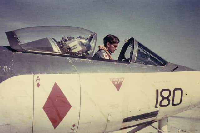 Lieutenant David Gunn RN carrying out preflight checks in a Seahawk fighter ground attack aircraft in the Mediterranean in 1958.