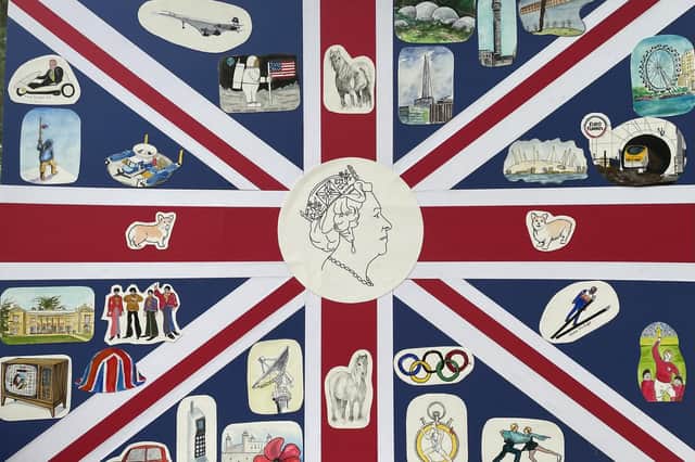 A special version of the Union flag commemorating various aspects of Queen's reign has been created by members of the Kineton Art Group.