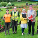 Heart of England in Bloom judges Nicola Clarke and Joe Hayden (centre) who met Rugby Borough Council gardeners (left to right) Catherina Holyoak, Leah Anderson-Howe, Bradley Herriott and Chris Cox at Caldecott Park during the tour of the town in July.