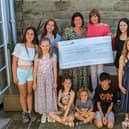 Jenni Fuller (right) and Katie Best from the Samaritans with some of the younger fashion models. (Photo supplied by Shawn Gladwim)