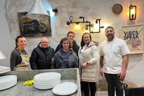 Geanina and Jose Ribeiro, owners of We Love Pizza welcoming the Bannister family for their special dinner. Photo supplied