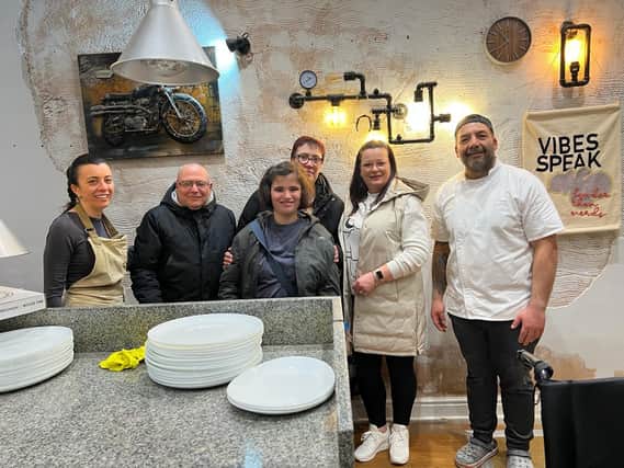 Geanina and Jose Ribeiro, owners of We Love Pizza welcoming the Bannister family for their special dinner. Photo supplied