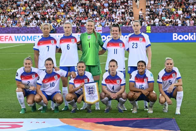 Jess Carter, front row second from the right wearing the number 16 shirt with the Lionesses (Photo by SEBASTIEN BOZON / AFP) (Photo by SEBASTIEN BOZON/AFP via Getty Images)