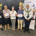 Volunteers from Escape Arts receive their awards.
