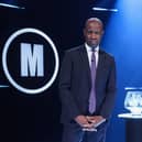 Host Clive Myrie with Mastermind trophy