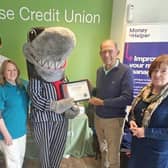 The Clockwise Credit Union team get their award from Stop Loan Sharks mascot Sid the Shark