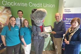 The Clockwise Credit Union team get their award from Stop Loan Sharks mascot Sid the Shark