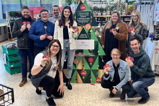 Morrisons staff members Charlotte, Alex, Hayley, Chris and Daisy with Susan and volunteers from the LWS Night Shelter. Photo supplied