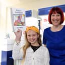 Winner Ruby Pickering with branch manager Sarah Cave.