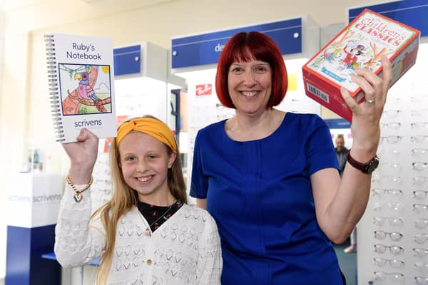 Winner Ruby Pickering with branch manager Sarah Cave.