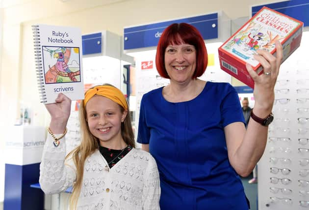 Winner Ruby Pickering with branch manager Sarah Cave.