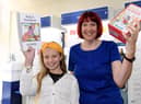 Winner Ruby Pickering with branch manager Sarah Cave.